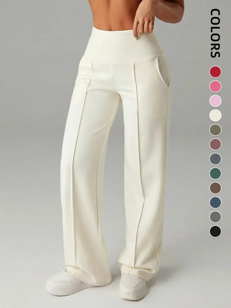 Pantalones de mujer de tiro medio, cintura elástica y pernera ancha; estilo deportivo casual, cómodos bolsillos laterales; prenda versátil para primavera y otoño; ideales para el día a día; moda femenina.